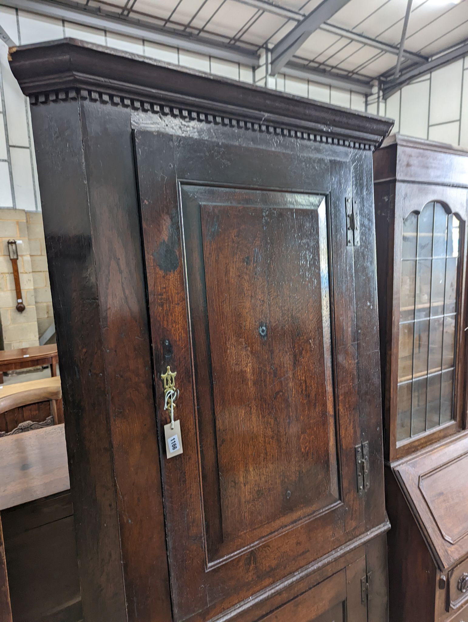 A George III oak standing corner cabinet, width 94cm, depth 38cm, height 202cm